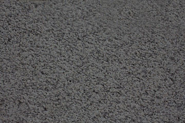 Rough grey concrete surface.