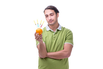 Young man in GMO fruits and vegetables concept