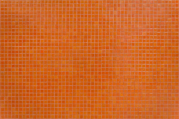 Wall orange tiles with little mosaic squares.