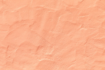 orange plaster wall in rough structure