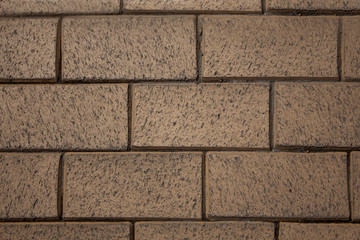 Beige grey wall bricks.