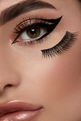 close-up of woman eye with sexy make-up and perfect brows