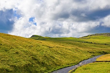 Naklejka premium Clouds gathering over Ingleton, in the Yorkshire Dales, on Saturday, 17th August, 2019.