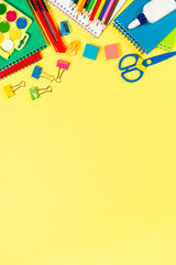 School and office sstationery on yellow background.