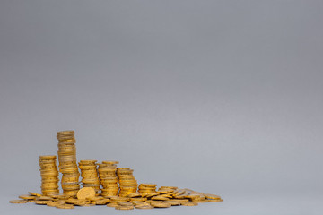 Stack of coins, on gray background.