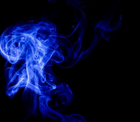 Blue smoke on black background