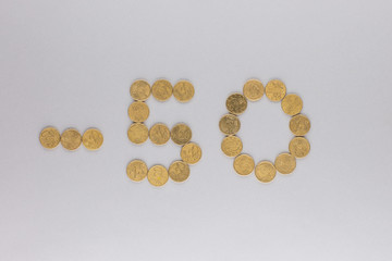 -50 made from coins shot from above, on white background.