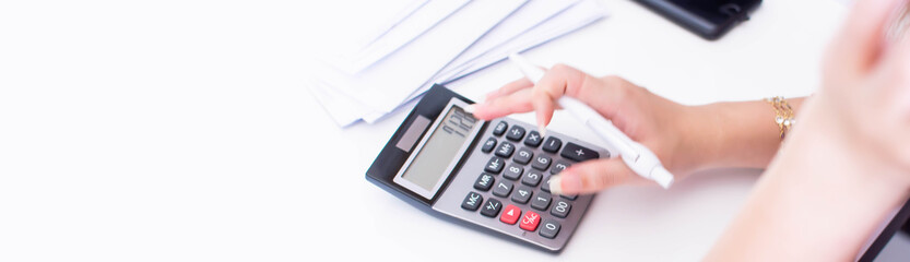 Banner of hand and calculator on white table
