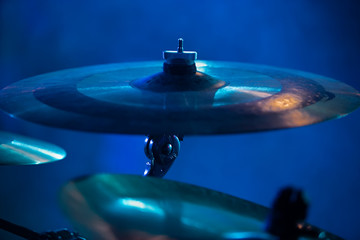 Professional drum kit on stage at rock concert in night club