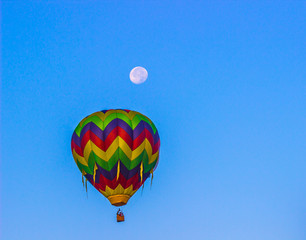 Fototapeta premium Multi Colored Striped Hot Air Balloon With Moon Above