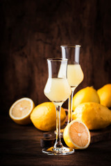 Limoncello, sour sweet Italian lemon liqueur, traditional strong alcoholic drink. Copy space, selective focus