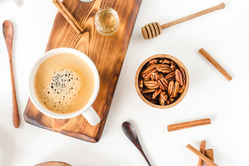 Breakfast with coffee and croissants on wooden table, top view