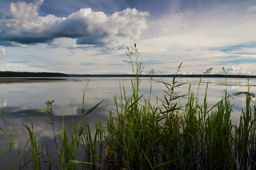 Evening at the lake. Water surface. Beautiful sunset.