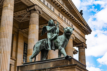 Obraz premium Bronze lion and angel statue in front of the Berlin Concert Hall on Gendarmenmarkt in Berlin
