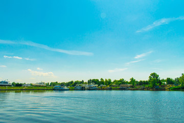 Dnieper river bank with many motor yachts