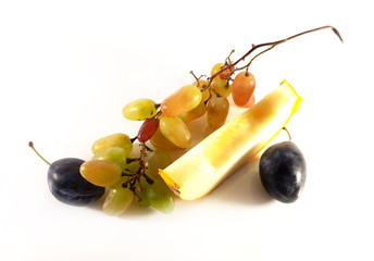 Grapes, plum and melon. Fruits on white background. Diet vegetarian food, photo.
