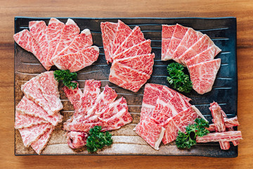 Top view of Premium Rare Slices many parts of Wagyu A5 beef with high-marbled texture on stone...