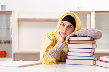 Female student in hijab preparing for exams
