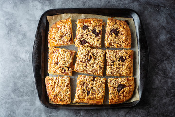 Crumble fruit pie. Homemade sweet pie slices in baking pan. Top view.