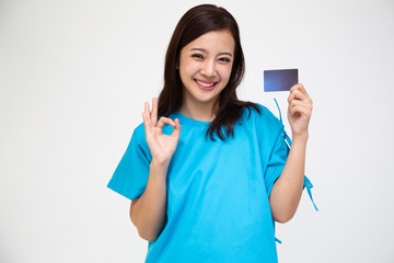 Young Asian beautiful woman patient showing personal accident insurance care card and ok sign isolated on white background, PA and health claim services concept