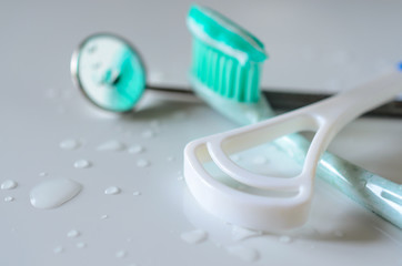 Dental tools toothbrush and tongue cleaner. Oral hygiene health concept.