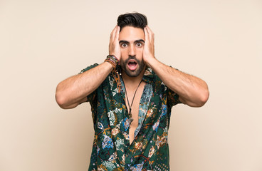 Handsome man in summer shirt over isolated background with surprise facial expression