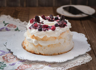 Angel food cake topped with berry sauce