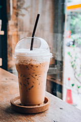 cold iced coffee on wooden table