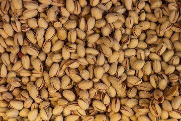 pistachios background nuts top view in market counter ready for selling 