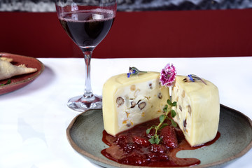 mozzarella cheese stuffed with nuts cut in half with strawberry jam