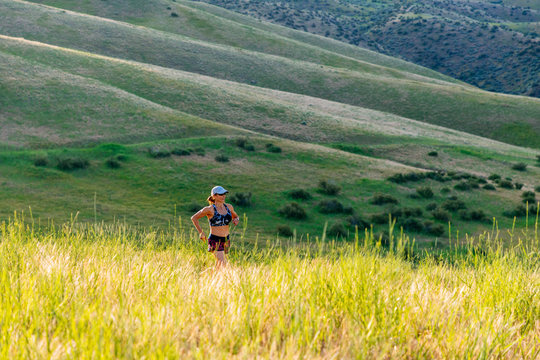 A Woman Trail Running In Early Light On A Trail In The Military Reserve, Boise, Idaho, USA