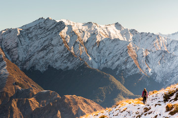 New Zealand, Otago. A woman hiking the Moonlight Track near Queenstown.