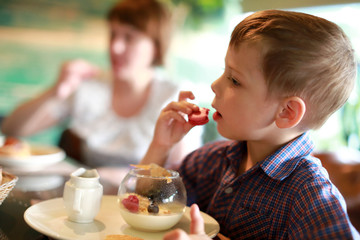 Child eating Macaroni dessert