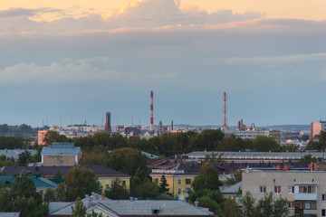 Epic storm clouds at sunset over city skyline