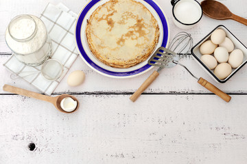 Cooking pancakes. Ingredients, crockery and kitchenware for pancakes.