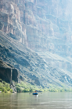 Two people in a raft on a calm stretch above Lava Rapid, Grand Canyon National Park, Arizona, USA