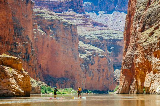 Man and woman paddling in Colorado River