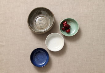 plates, cutlery and bowls viewed from above