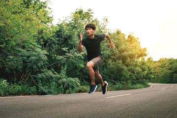 Man athlete runner feet running on the road. Concepts jogging outdoors.