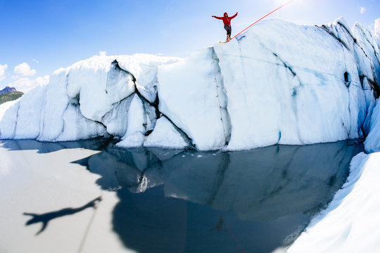 Man slackline over Matanuska Glacier at Alaska