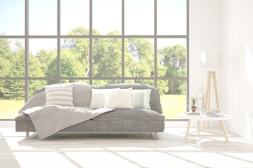 Stylish room in white color with sofa and summer landscape in window. Scandinavian interior design. 3D illustration