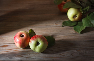 garden apples on a wooden background with place for text