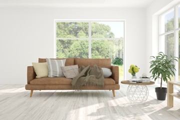 Stylish room in white color with sofa and summer landscape in window. Scandinavian interior design. 3D illustration