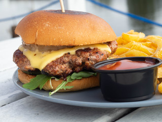 Gourmet Tasty Steak Burgers with meat cutlet, french fries and Dipping Sauce, selective focus