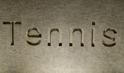 Tennis inscription engraved in stone