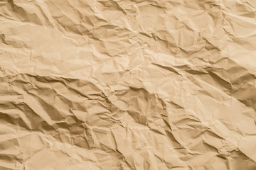 Beige wrinkled paper sheet. Cellulose industry. Abstract art background. Copy space.