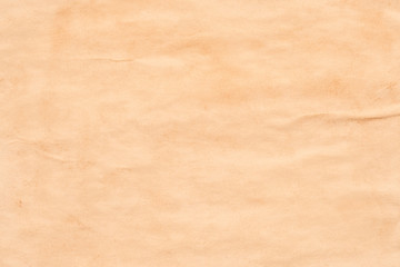 Blank brown aged paper sheet. Wrinkled texture. Abstract art background. Copy space.