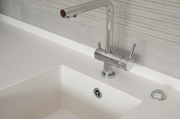 metal faucet in the kitchen