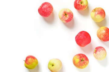 Ripe red apples on a white background