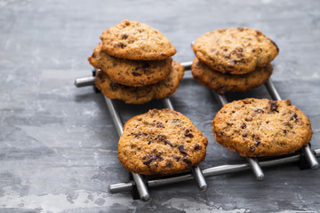 oat cookies with chocolate on ceramic background